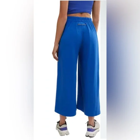 FREE PEOPLE MOVEMENT HOT SHOT SLIT WIDE LEG PANTS INDIGO, SMALL NWT - Picture 4 of 7